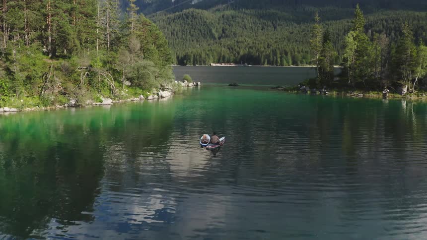 Aerial shot of a lake in front of some mountains
