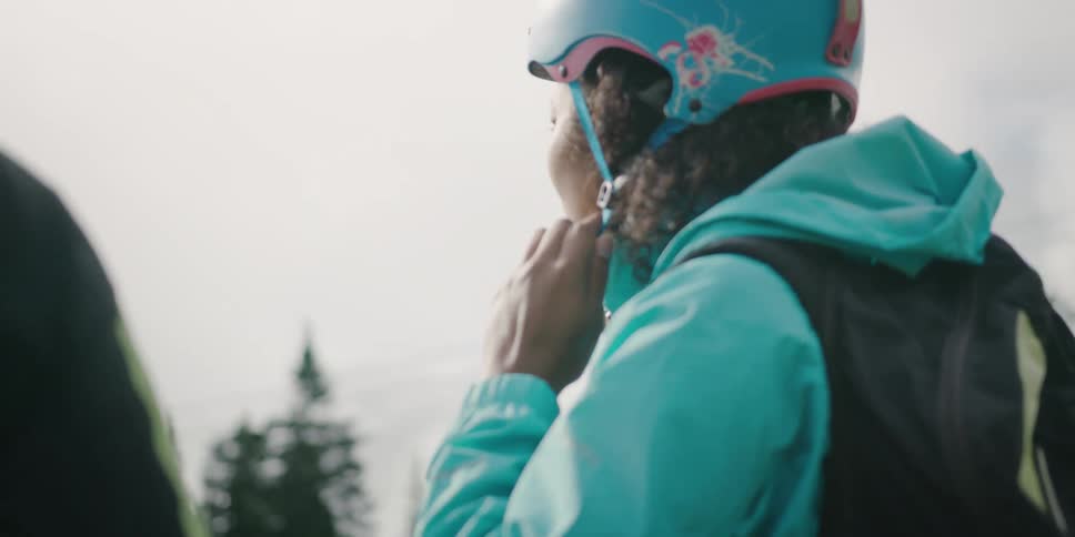Asian woman wearing the helmet prepares to go paragliding