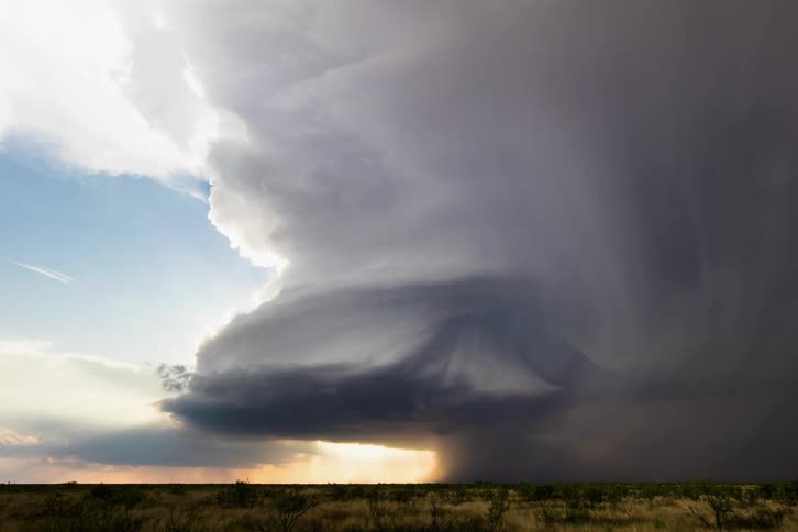 An incredible sculpted supercell over desert brush