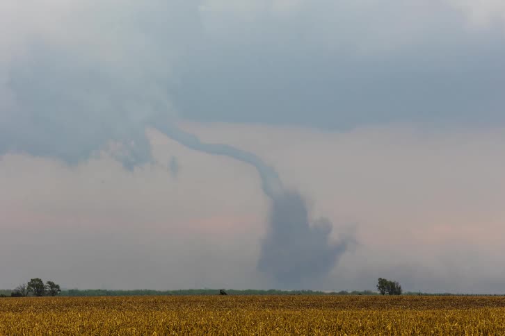 Tornado moves across the surface of the land
