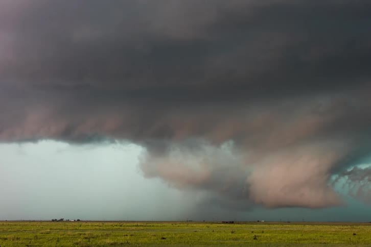 Dark stormy clothes gather in the sky over the plains