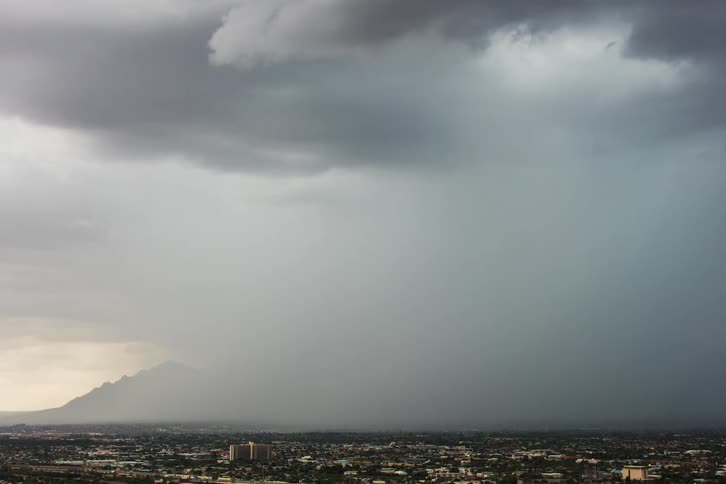 A storm rolls over a city