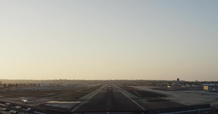 The plane descends to land on the runway