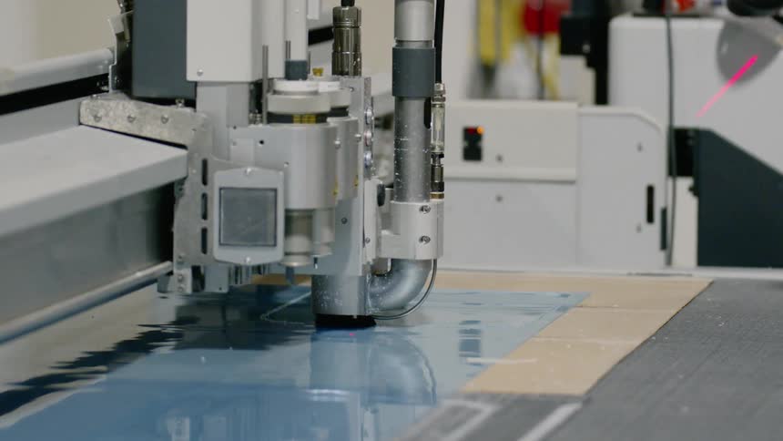 A machine cuts the sheet