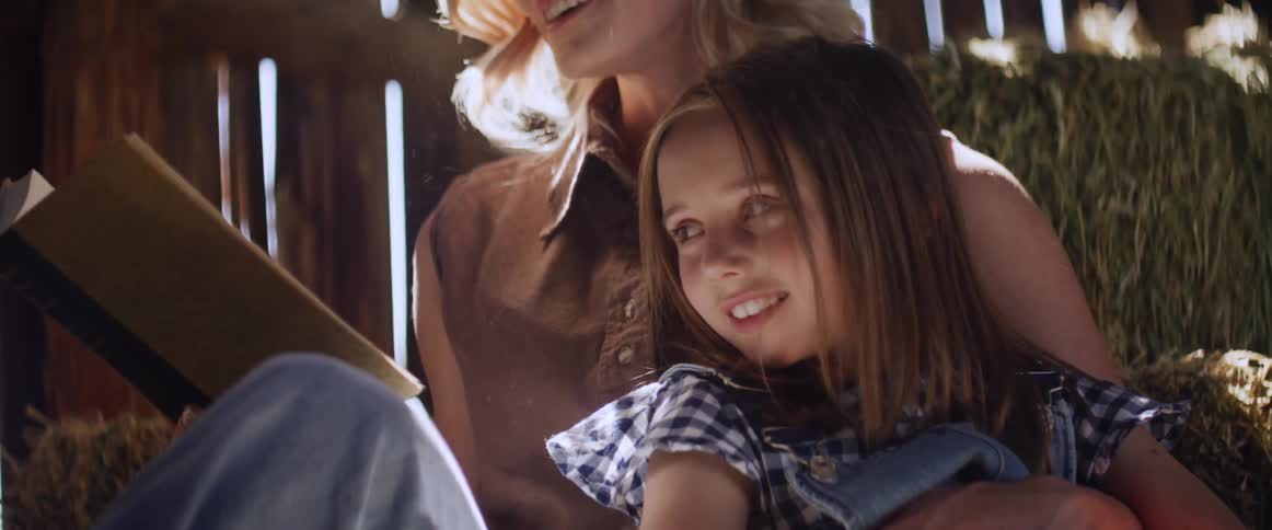 A mother reads to her daughter