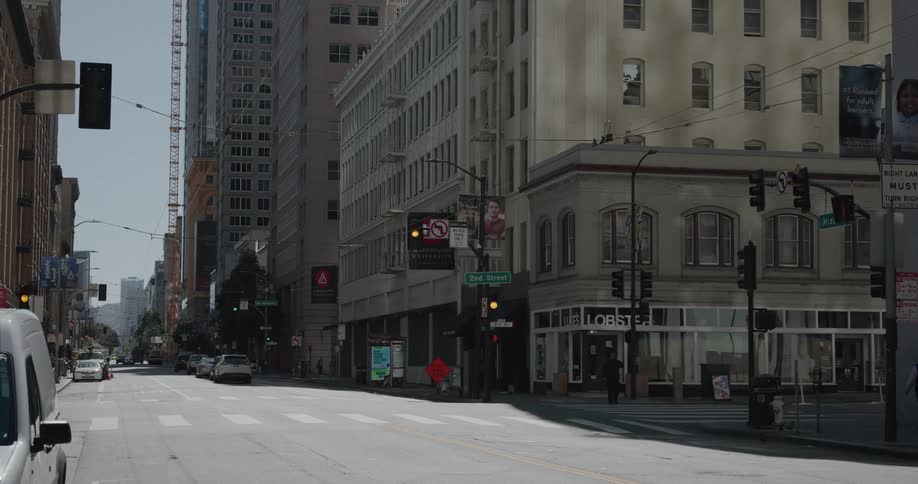 Pedestrians are walking through a downtown city