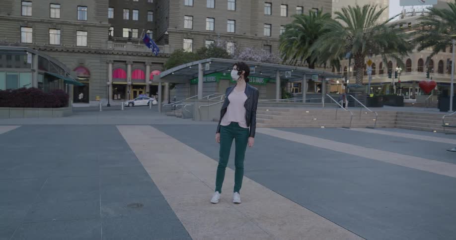A woman standing in a plaza