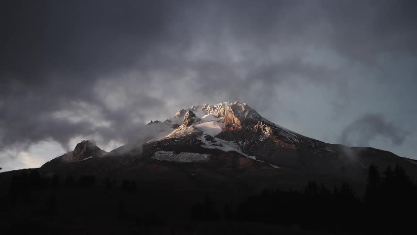 Dark clouds move over the mountain top