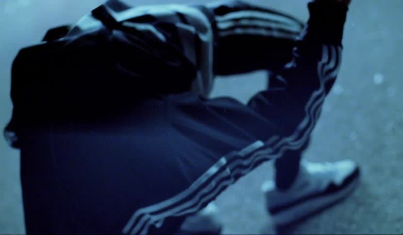 A person is leaning back frozen in place