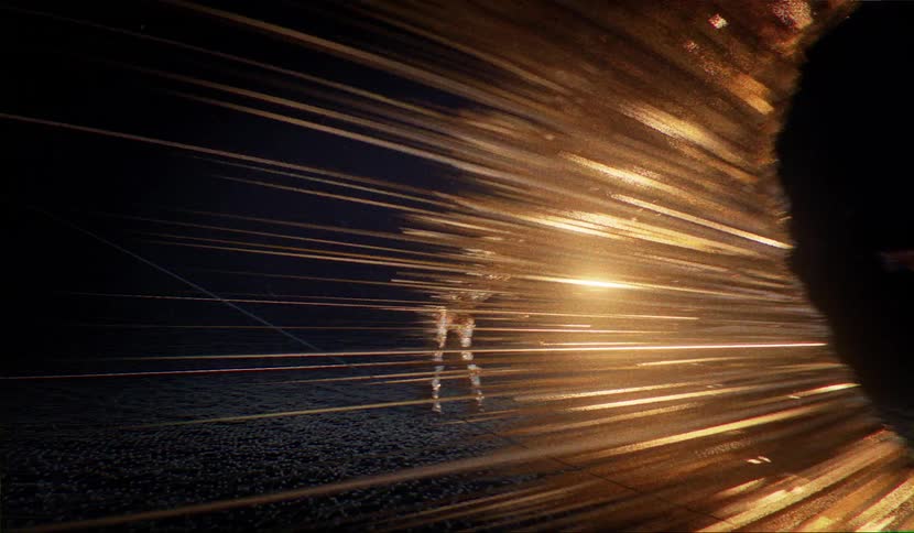 Men dancing outside with flares coming off of their bodies