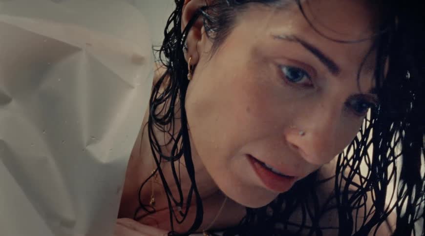 Hazel eyed woman tries to breathe in the bathtub in the bathroom