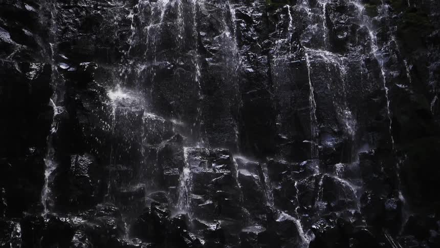 Water flows and splashes down the waterfall