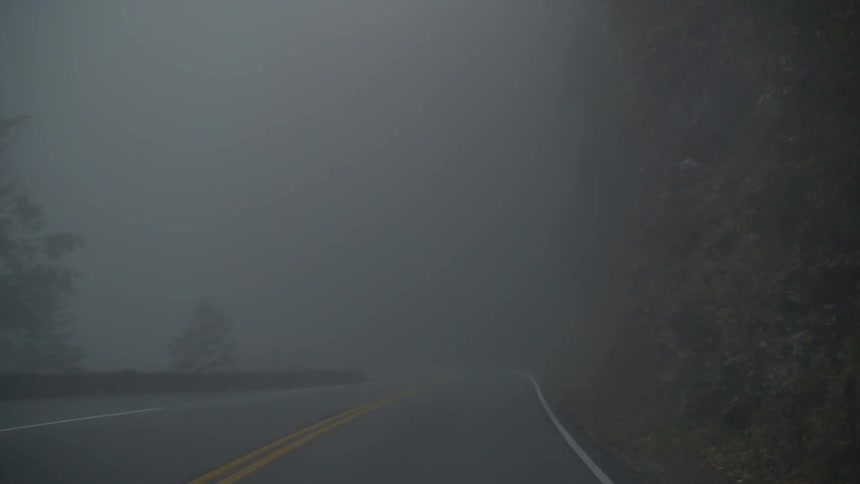 Driving down a very foggy road
