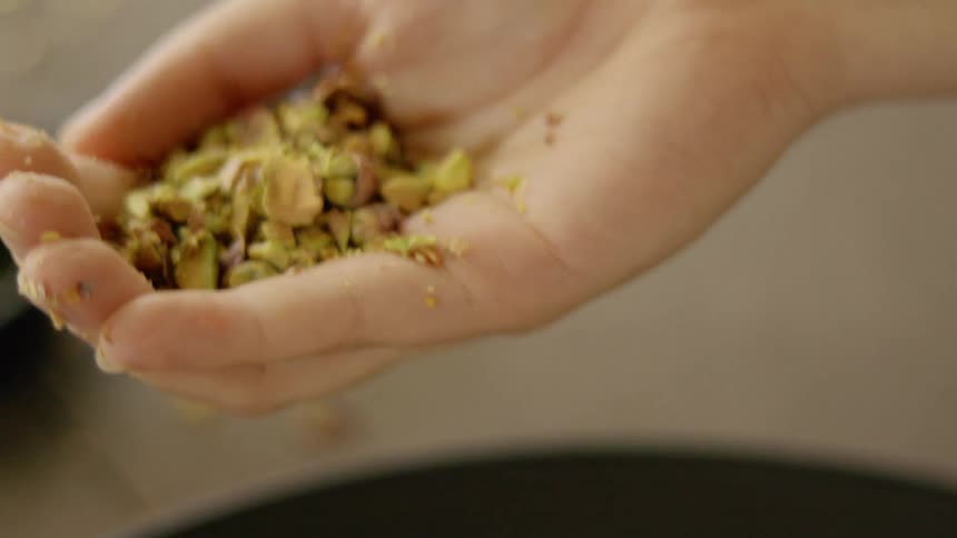 Grabbing a bit of pistachios