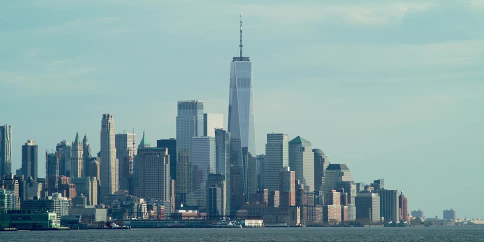 A city skyline with the water in front