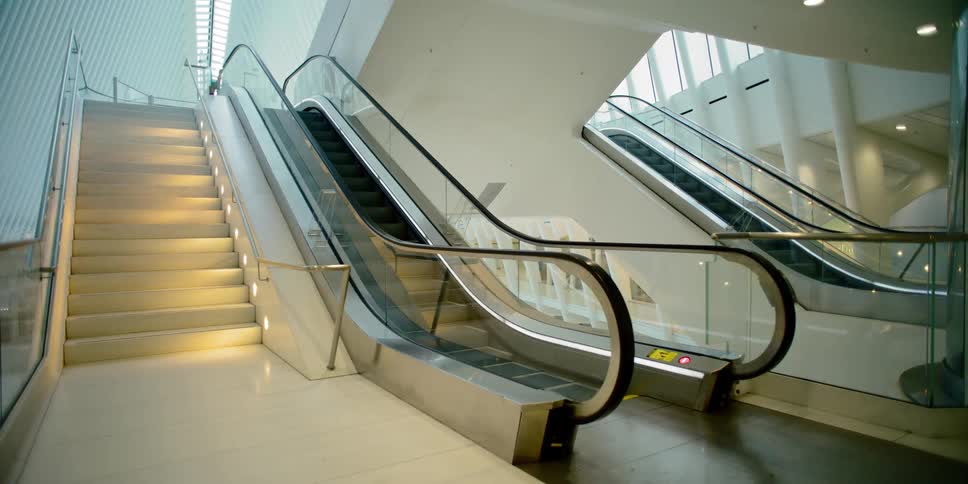 Unused escalators run in empty building