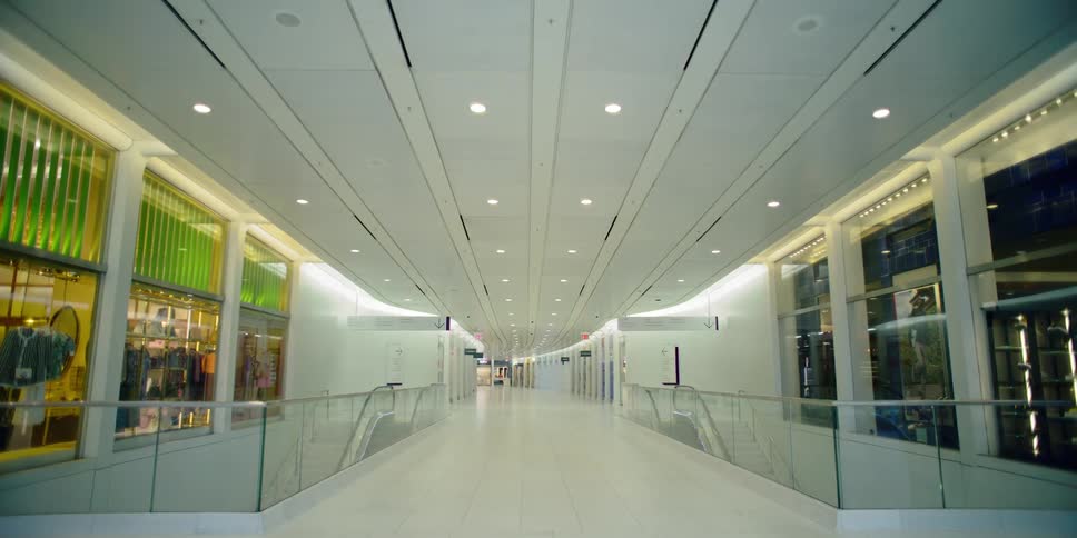 Stores stand empty near escalators in mall