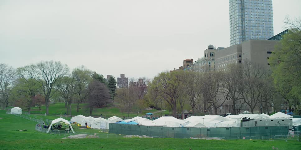 Tents are set up outside of a hospital