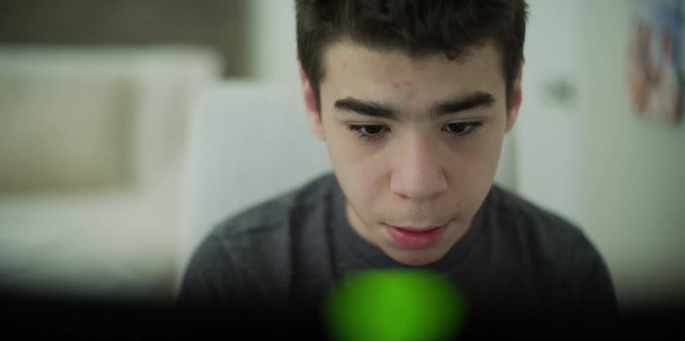 A child looks at something and speaks