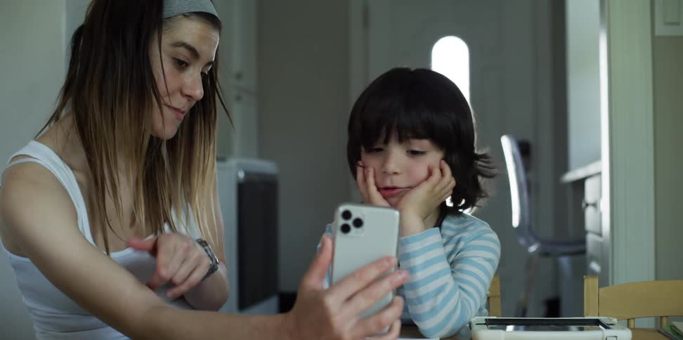 Son and mother looking at a phone