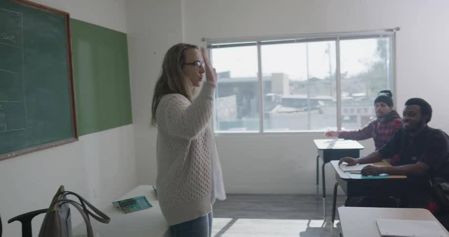 The teacher discusses with the students