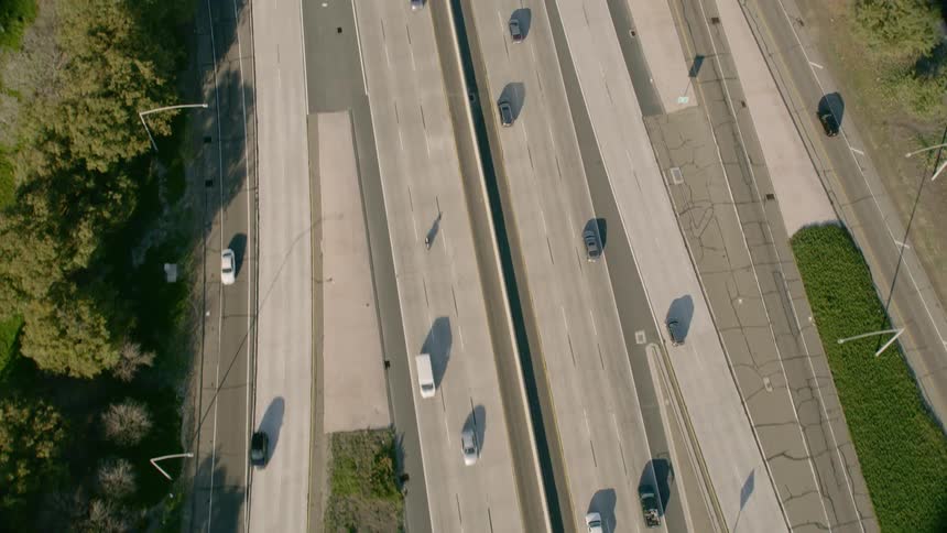 Birds eye view of vehicles driving down a highway