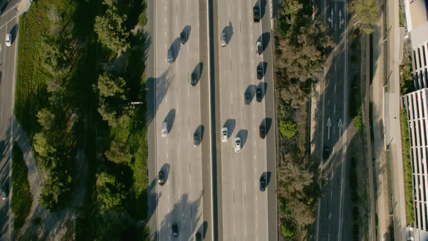 Top Down Aerial view of cars traveling on a multi lane highway