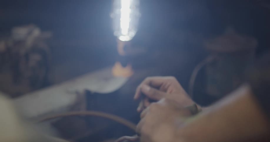 A man works on a vehicle