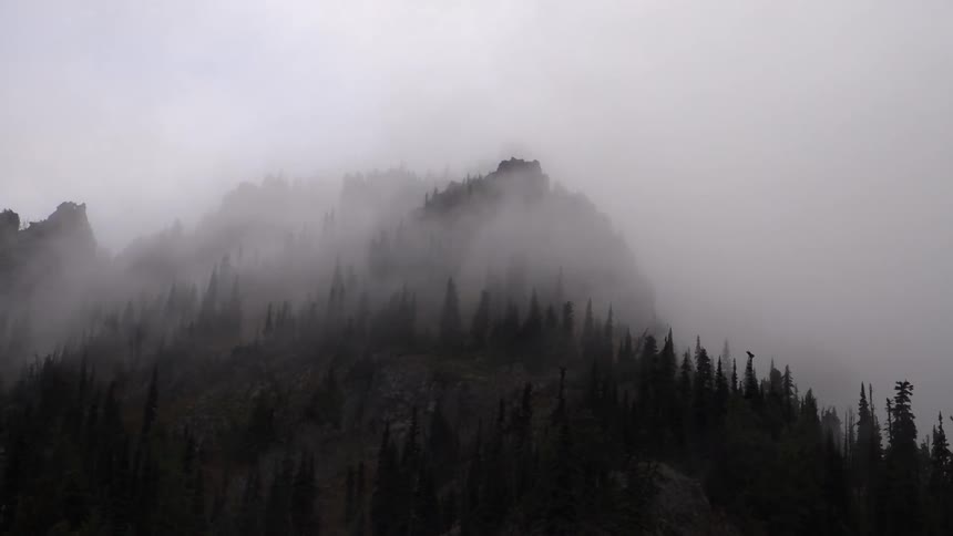 Fog covers the top of the mountain