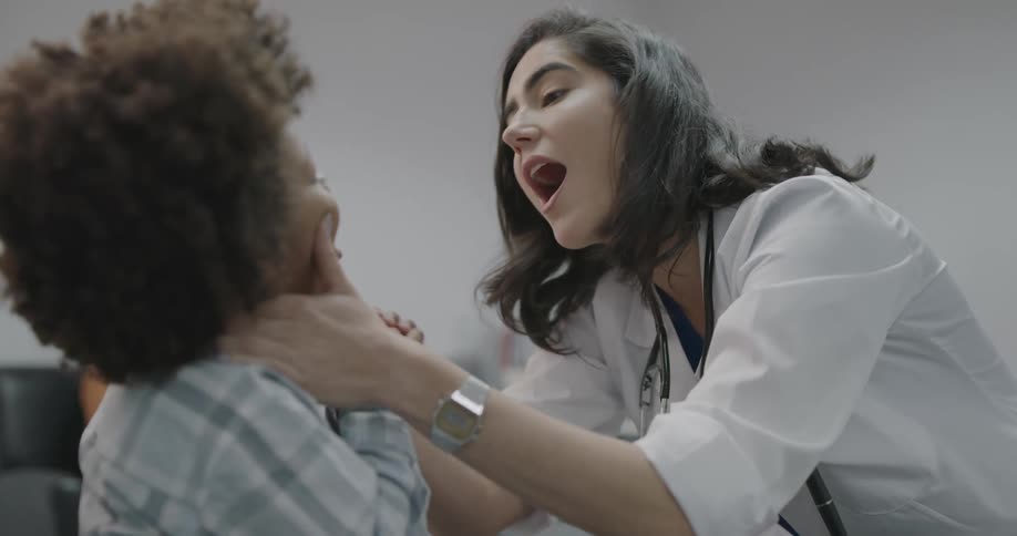A doctor working on a child paitent