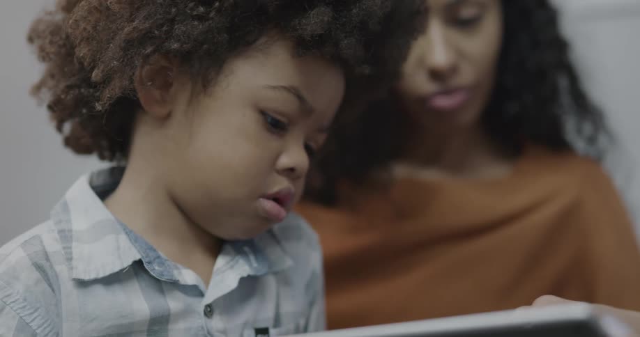 A child being talked to by a doctor