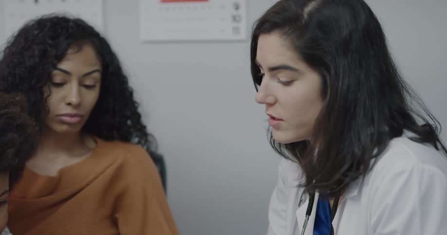 The doctor talks to her patients