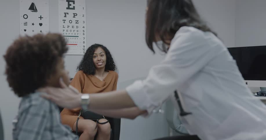 A doctor doing a check up on a child
