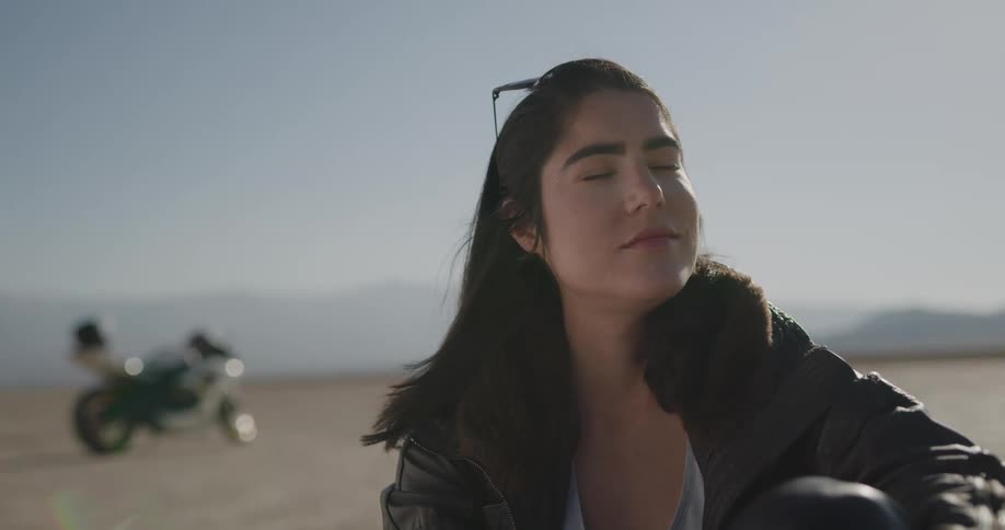 Female motorcyclist enjoys the dry plains