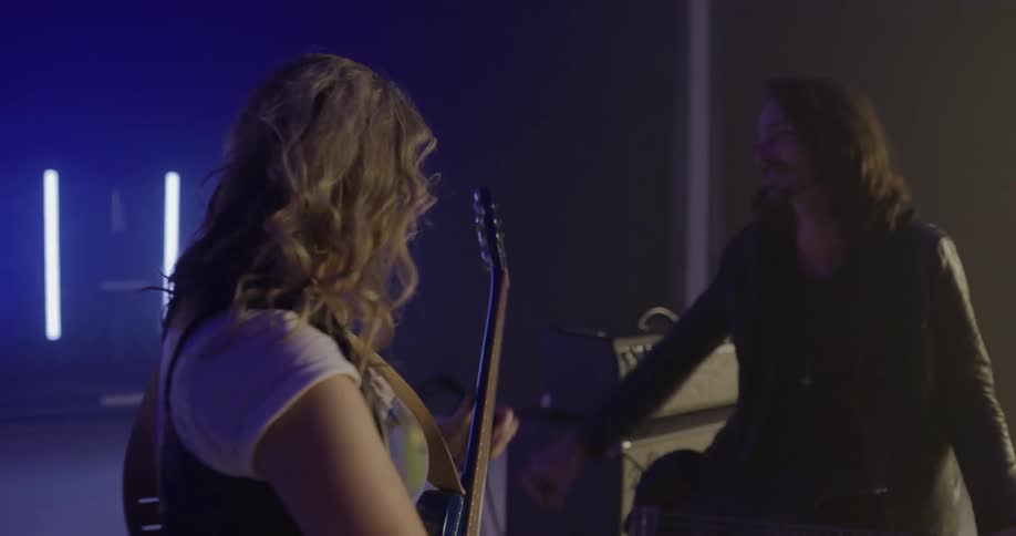 A rock band walks up to the stage