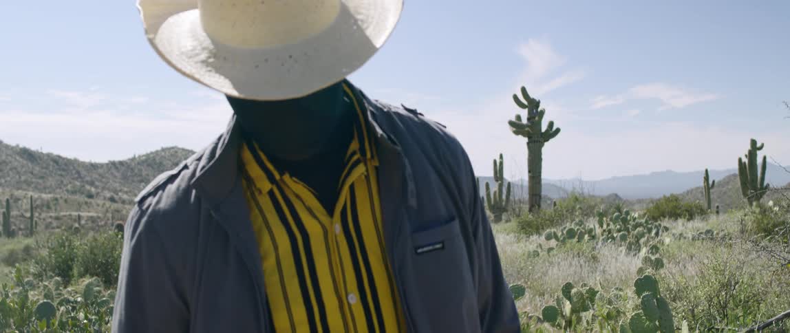 A man stands still in the desert