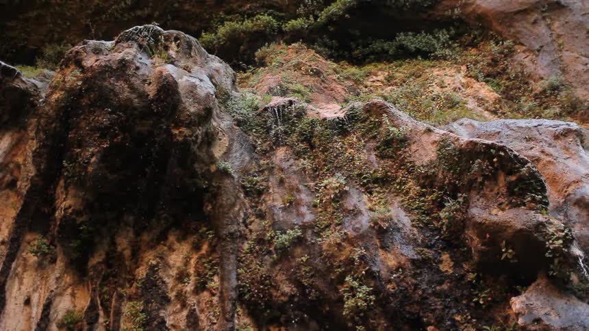 Water cascades over a cliff