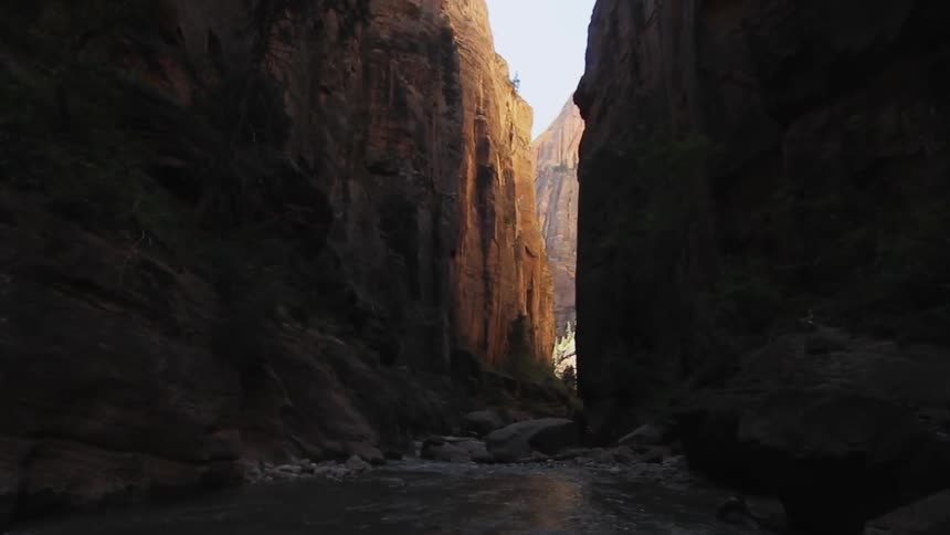 A river flows through tall cliffs