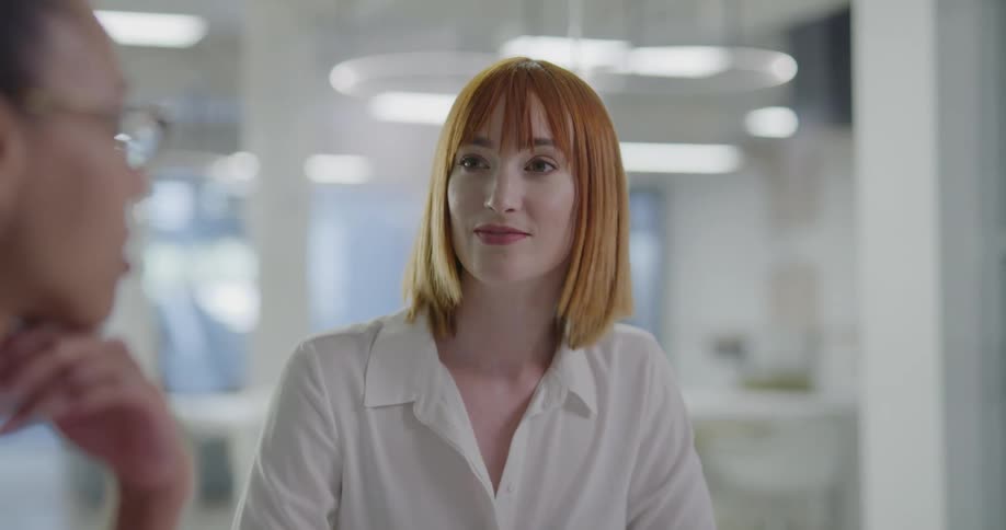 Women talking in a business meeting in the office