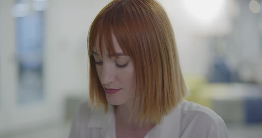 A woman sitting in an office talking