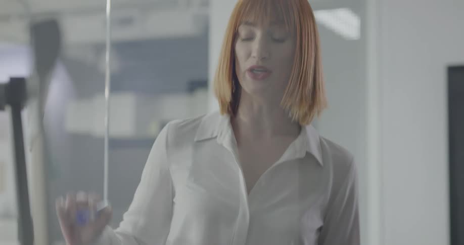 Three women brain storm in a conference room