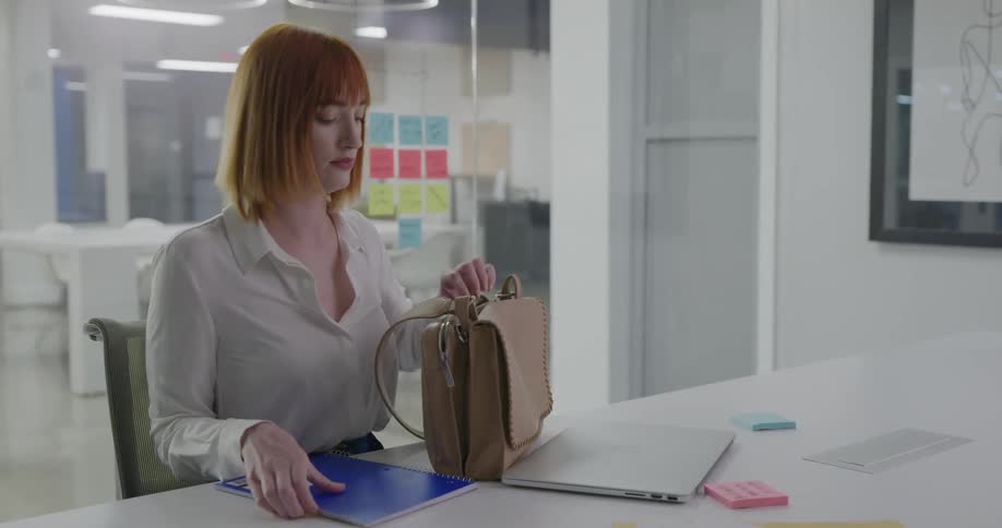 A woman preparing to leave the office