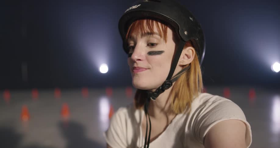 A woman with a helmet on talking