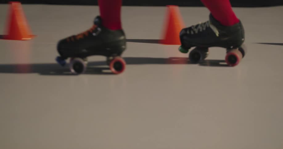 Women travel on surfaces with roller skates indoors