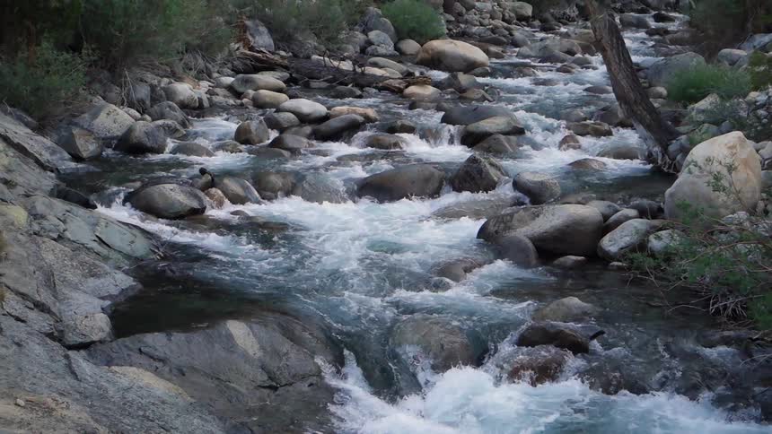 A stream flowing over and around rocks