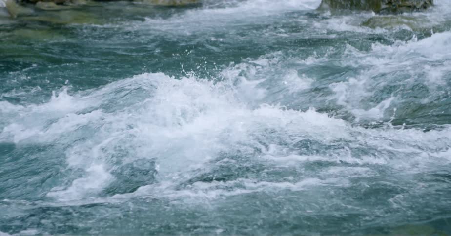 Water flowing over a stationary wave in a river