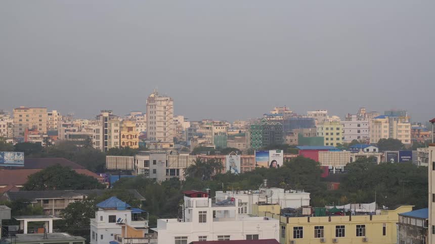 Colorful roof tops and buildings with city skyline behind