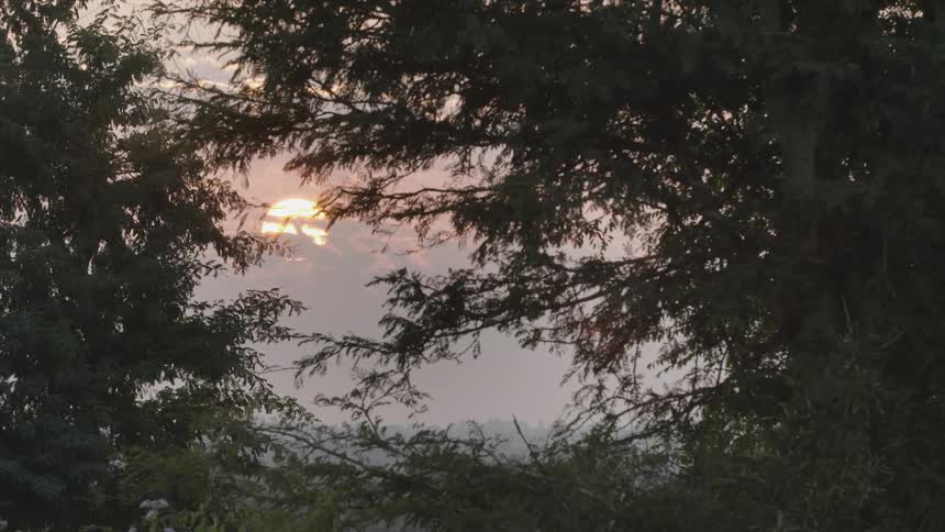 The sun is setting in the horizon