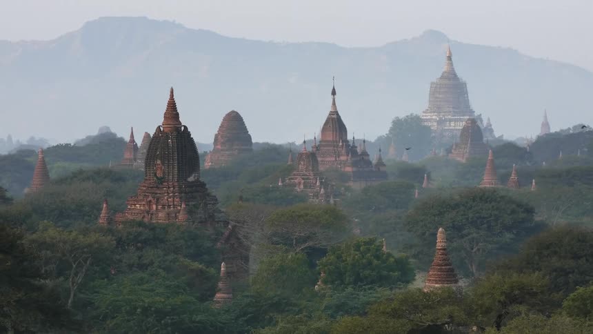 Ancient temples rise above a jungle