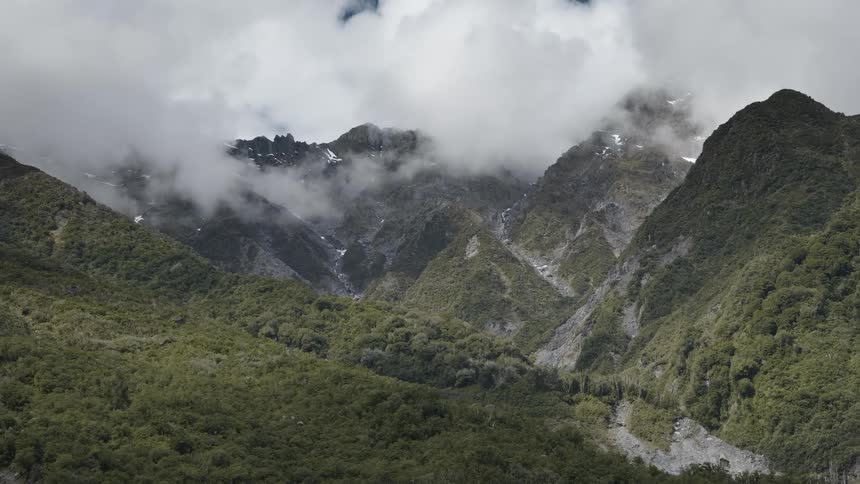 Clouds cover the top of the mountains
